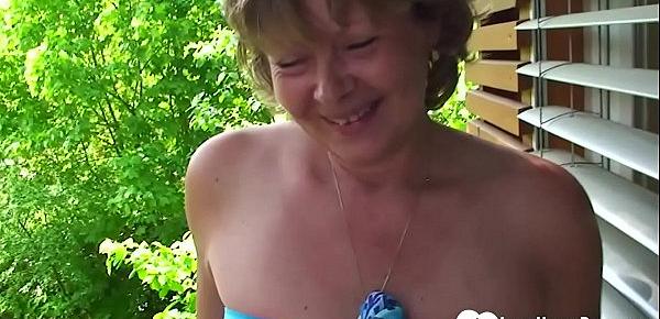  Busty MILF shows her pussy in a close-up